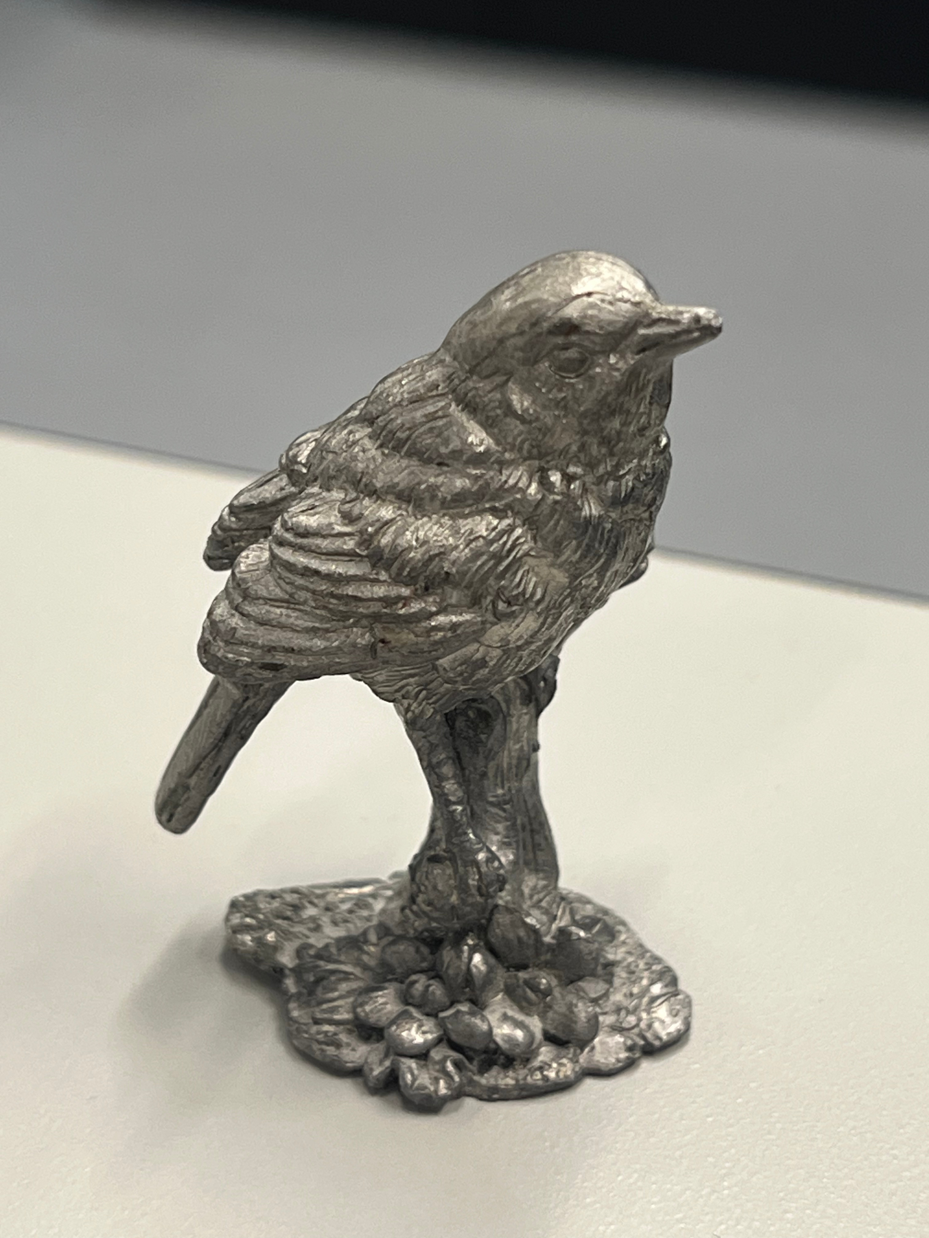Metal Bird Statue - refined - rigid - decorative trinket 